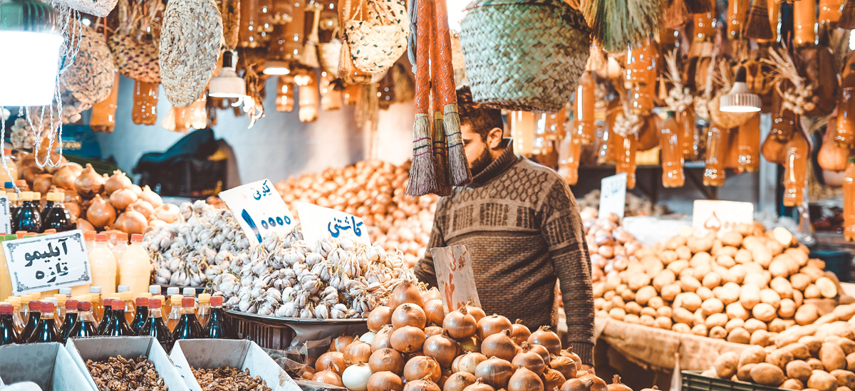 A middle eastern man at the market.